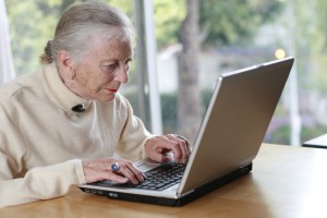 Elderly woman at computer